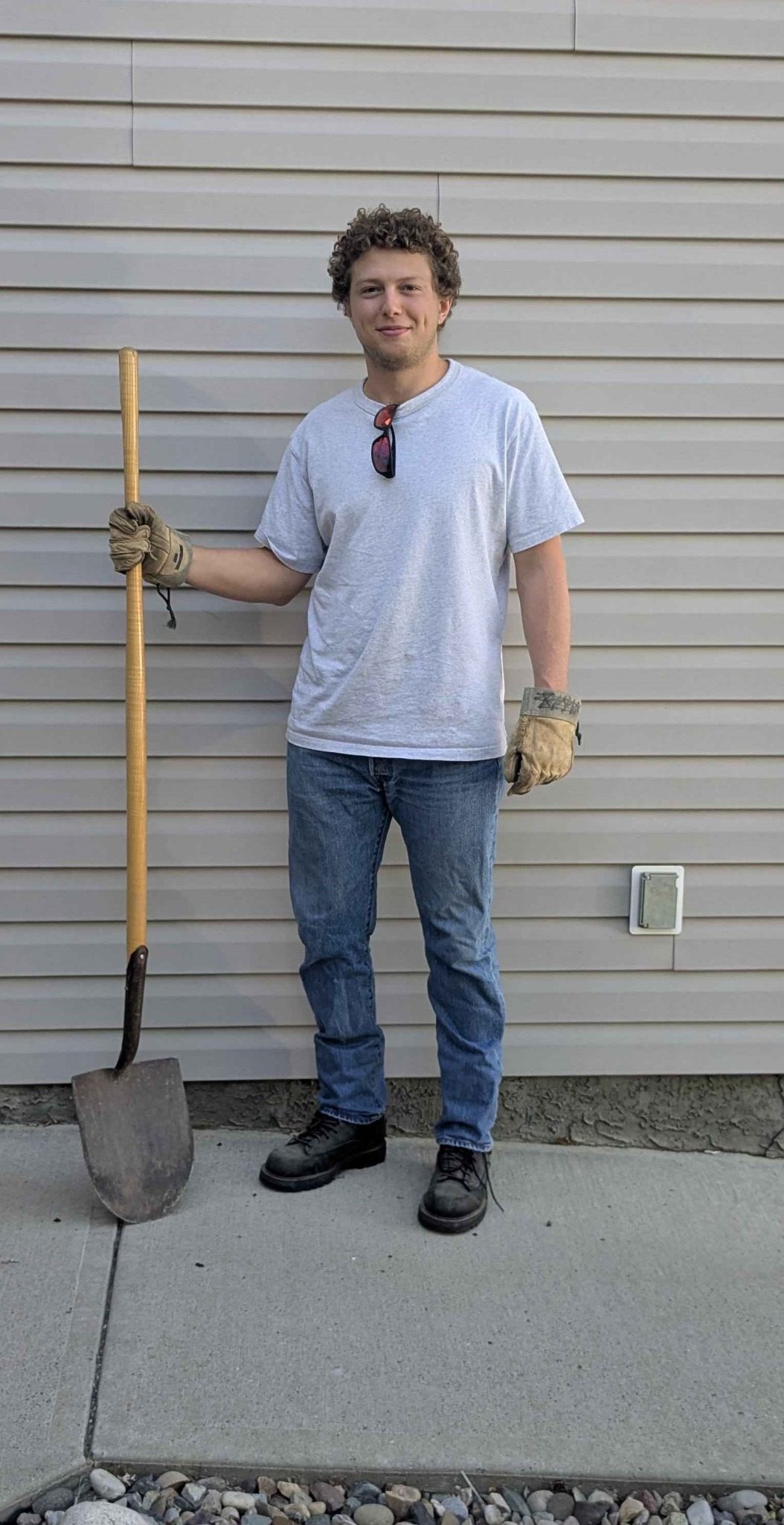 Junk Wizard owner with work gloves and shovel